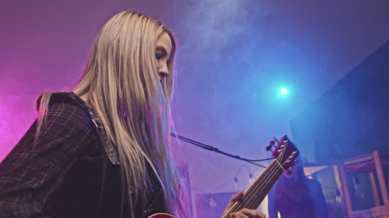 Rock Girl Playing Guitar During Concert