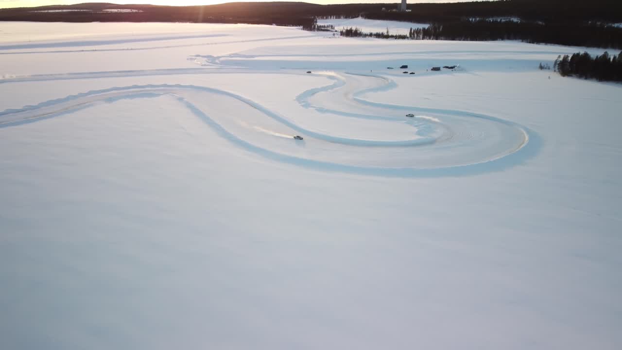 Race track on a Frozen Lake in Finland during golden hour – Aerial Winter Landscape high altitude