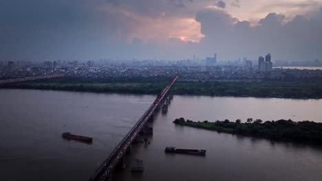at sunset’s close, the city’s hum, long bien glows, as night becomes