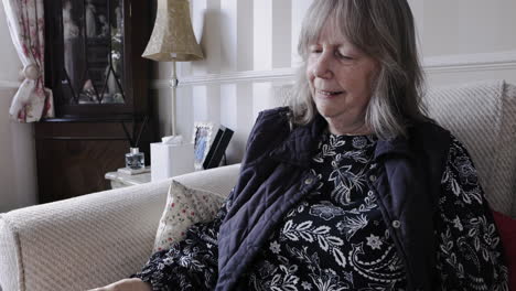 older woman reading a book