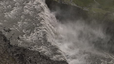 slow motion over the most powerful waterfall in iceland aerial shot cloudy day