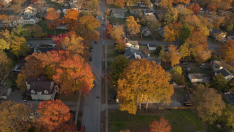 aerial view of a car driving down a street in a subdivision of kirkwood in st