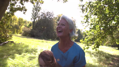 Woman-throwing-her-granddaughter-in-the-air-and-catching-her