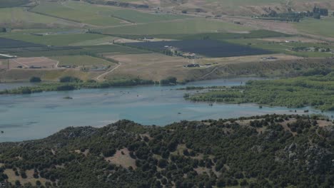 views of lake dunstan on a sunny day in otago, new zealand