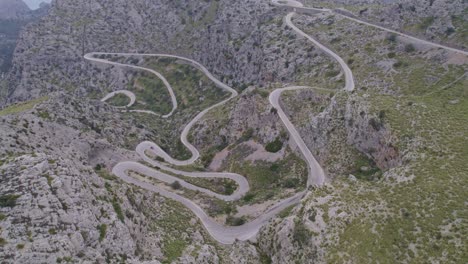 wide shot of populair cycling road coll dels reis mallorca spain, aerial