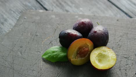 ripe plumbs on cutting board