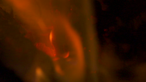 slow motion macro, flames burning in a red hot fire