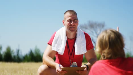 trainer instructing kids in the boot camp