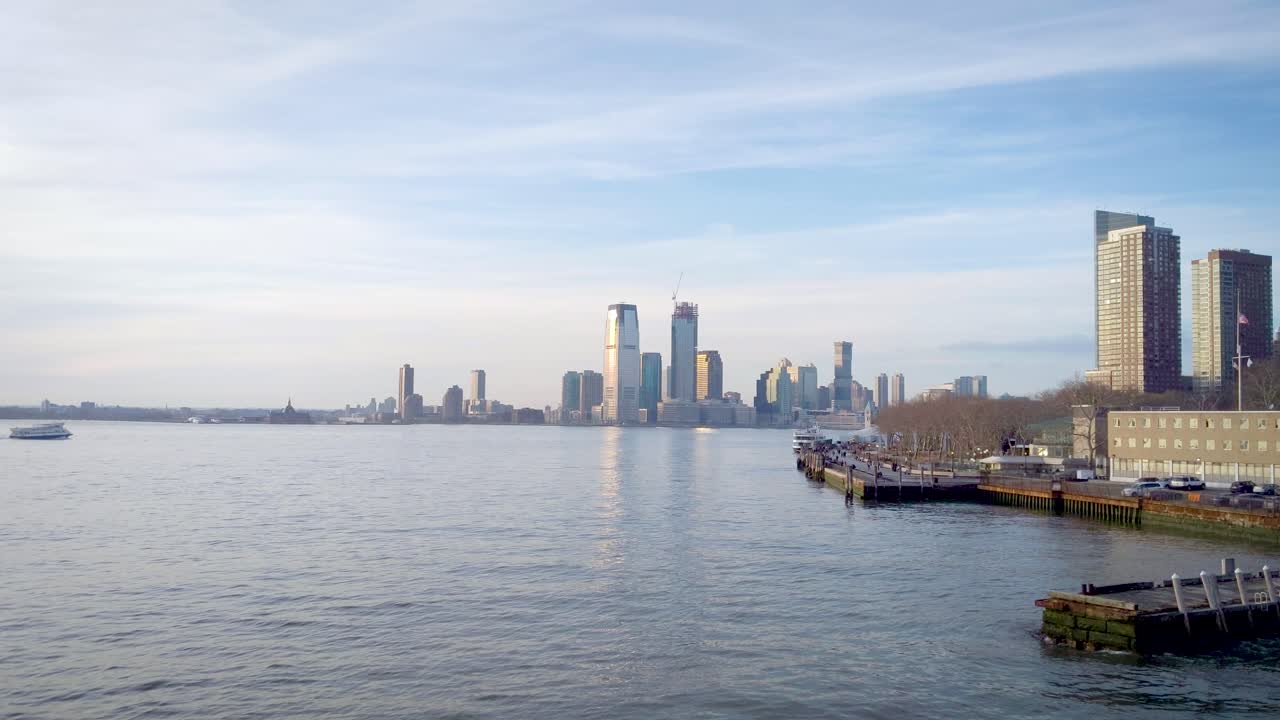 Pan down from skyscrapers in lower Manhattan to reveal the New Jersey waterfront skyline