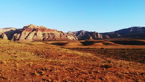 Morning-shadows-at-Red-Rock-Canyon-in-low-aerial-approach,-near-Las-Vegas-Nevada