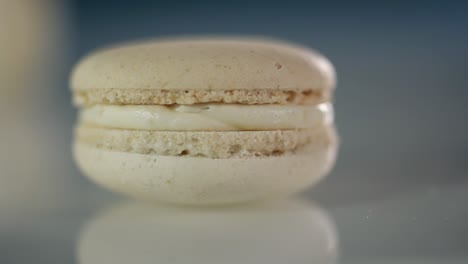 a white macaroon spins on the table