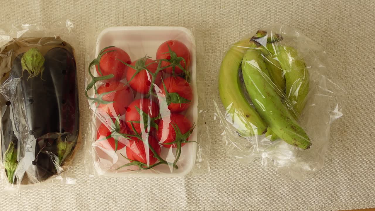 Tomatoes, Bananas, and Eggplant in Plastic Wrap