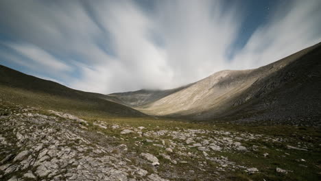 night star astro timelapse mountain olympus clouds moving fast peaks distance moonlight