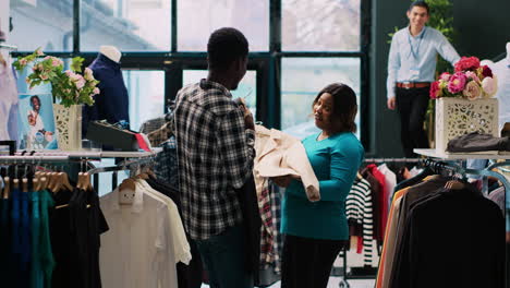 couple playing with stylish merchandise