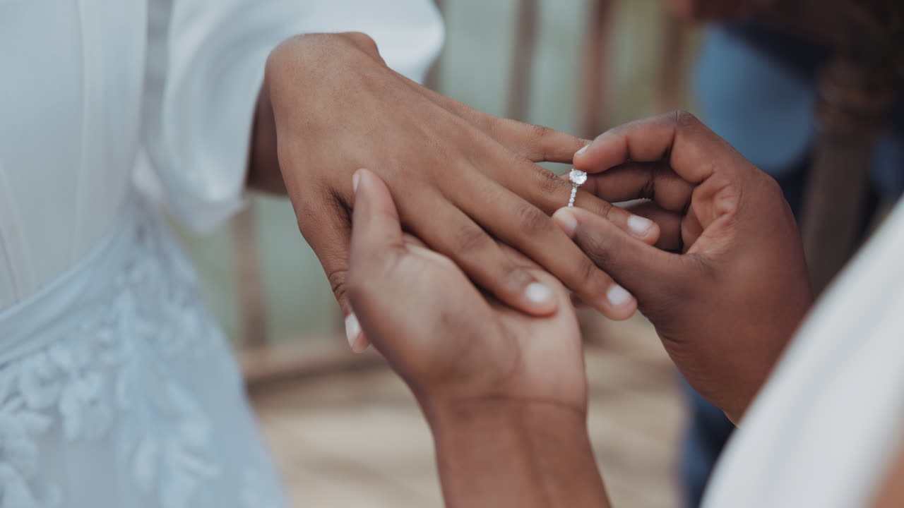 Couple, holding hands and jewellery for wedding