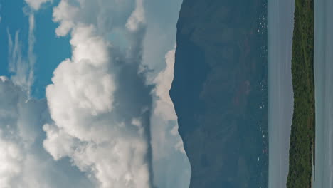 Huge-clouds-form-and-dissipate-over-Mont-Dore,-Grande-Terre-in-New-Caledonia---vertical-time-lapse