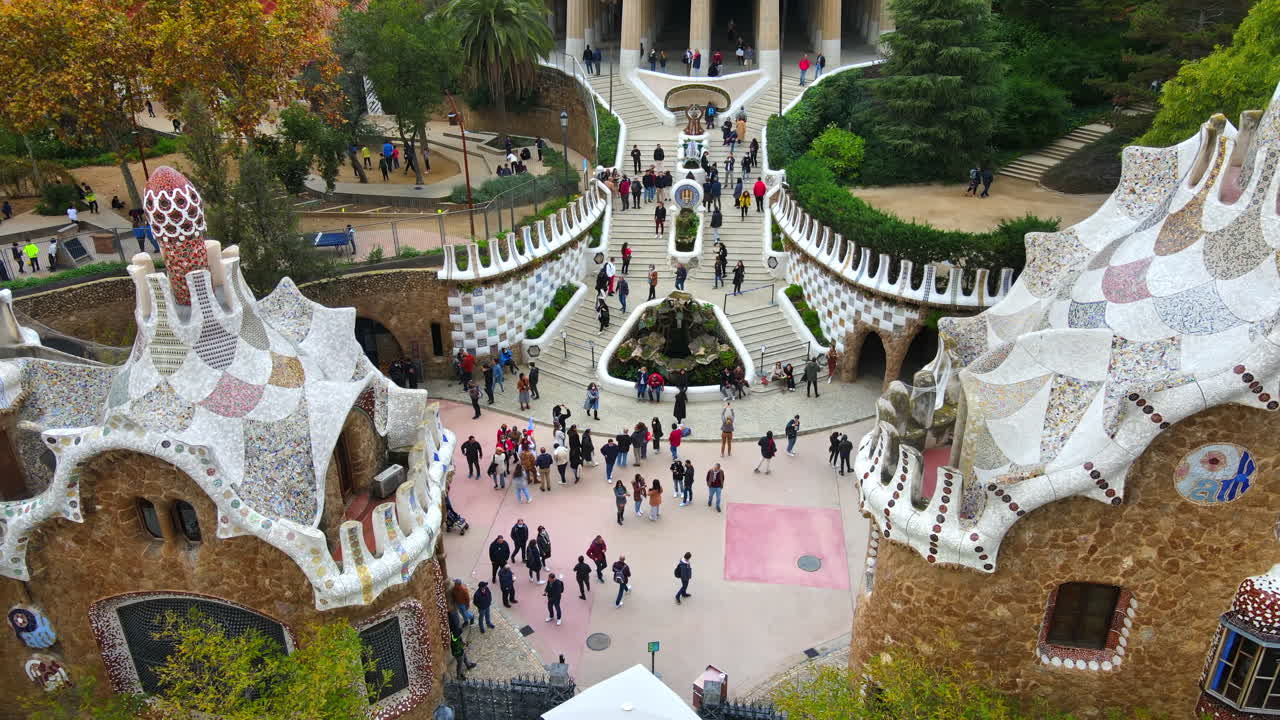 Aerial drone view of Barcelona, Spain. Park Guell with tourists, a lot of greenery