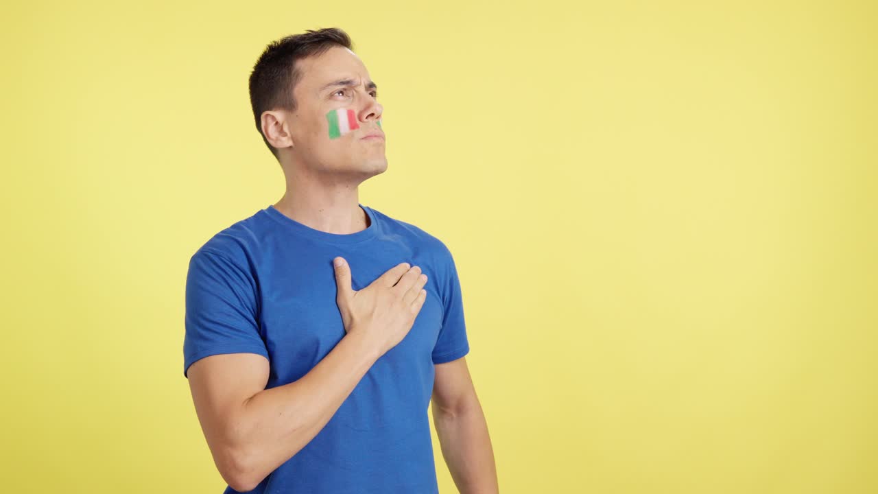 Italian patriot listening to the national anthem with solemnity