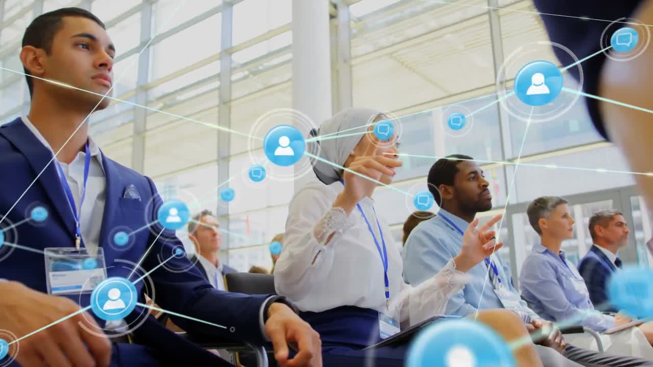 Animation of network of connections with icons over diverse business people in conference