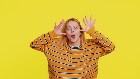 cheerful funny bully woman showing tongue making silly faces fooling around joking teasing