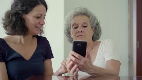 happy women using modern phone at home.