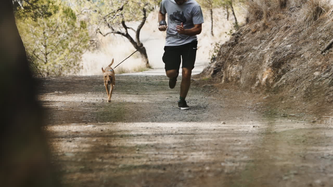 Short sprint running with hound puppy at Barcelona alps