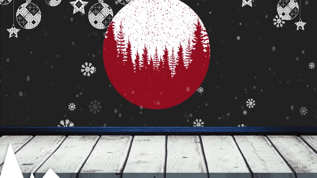黒背景に、クリスマスオーナメントの上を雪が舞い落ちるアニメーション。