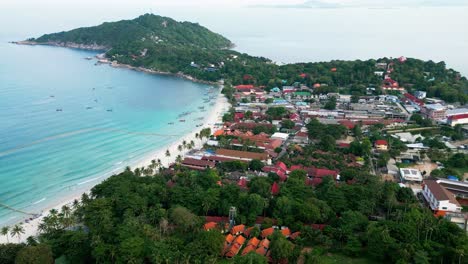 aerial zoom out white sand beach at haad rid koh pha ngan thailand travel destination waterfront hotels and palm trees
