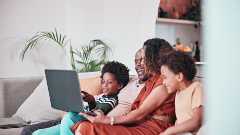 Home-laptop,-talking-and-happy-African-family