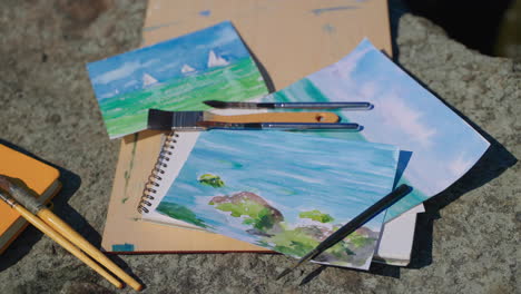 watercolor paintings of seascapes and art supplies