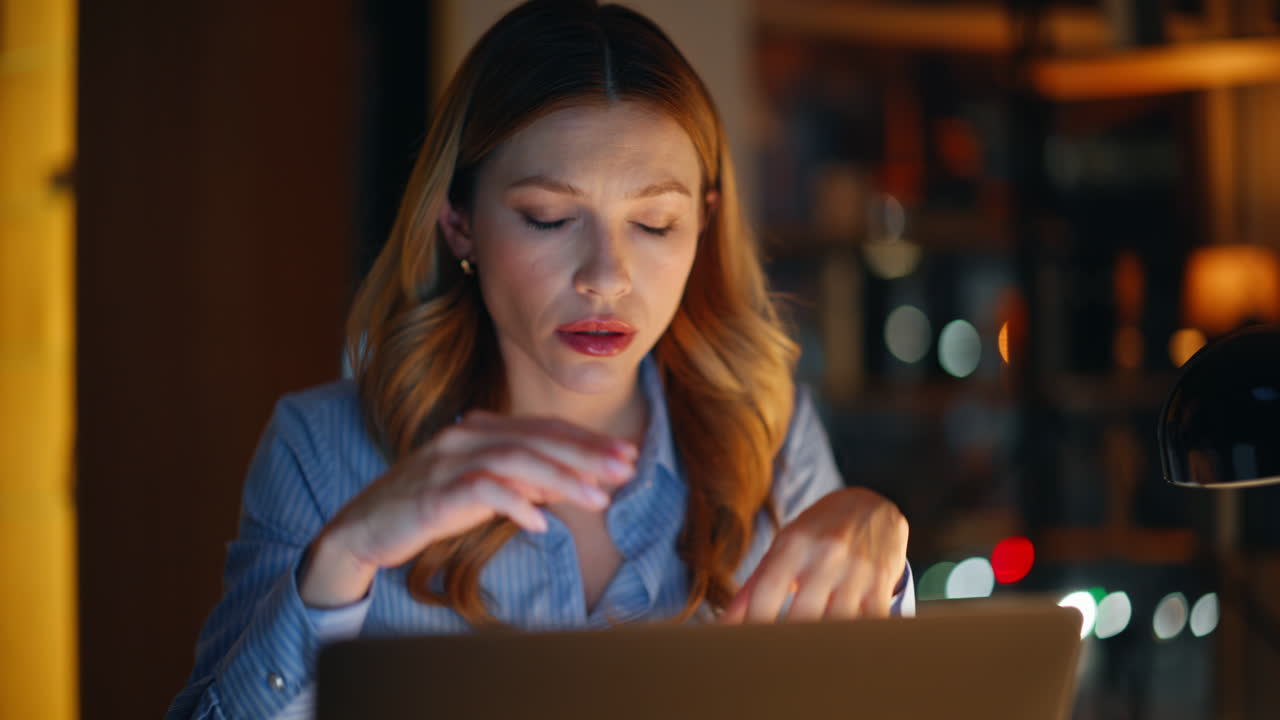 Programmer worried work issue feeling stress sitting night office closeup