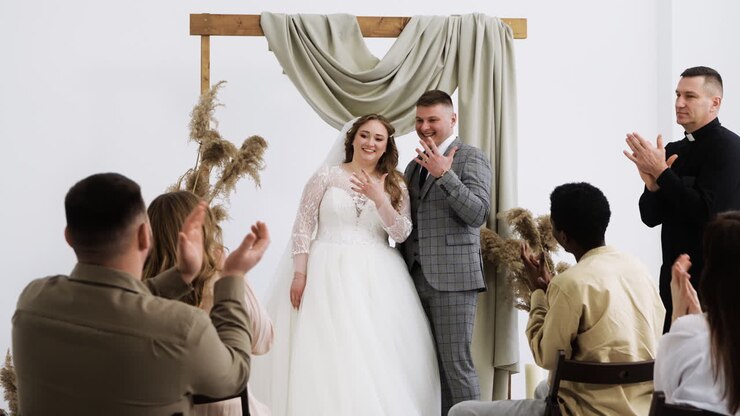 Couple showing the rings at the altar