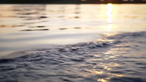 captivating sunset reflections on tranquil water surface: a serene display of nature's beauty and calmness as waves gently lapping against shoreline
