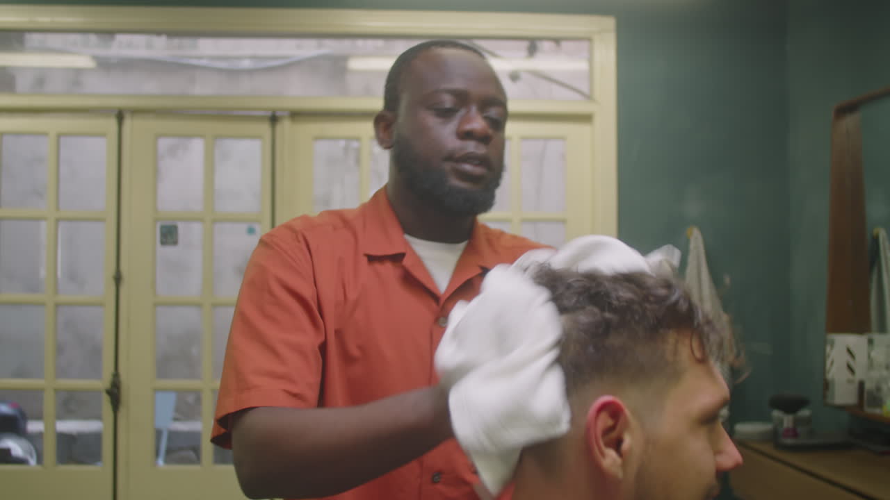 Barber Using Towel and Drying Hair of Client