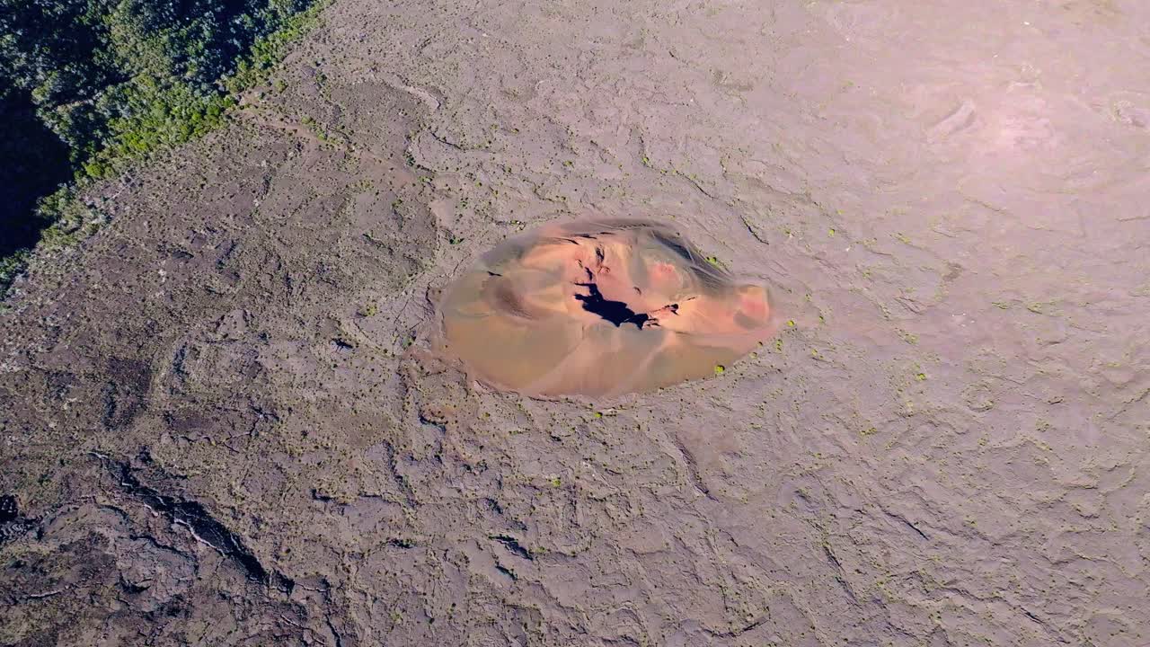 Drone view, flying over the Formica Leo crater in the caldera at high altitude with a tilt-down movement, Réunion Island