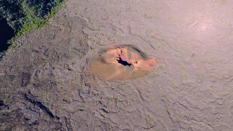 Drone-view,-flying-over-the-Formica-Leo-crater-in-the-caldera-at-high-altitude-with-a-tilt-down-movement,-Réunion-Island