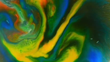 mixing colors of paints, abstract background of morphing shapes. amazing moving images created by spinning dyes.