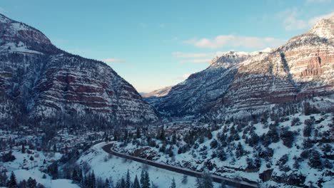 rising drone shot of ouray, colorado revealing the town from the south