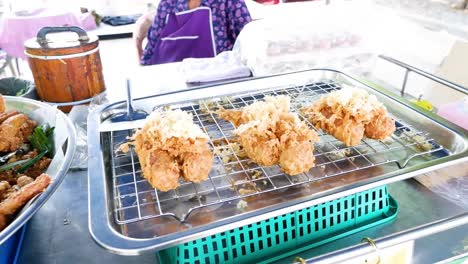 fried bananas being prepared at a food stall