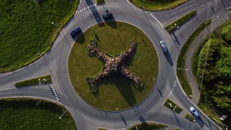 Ascending-aerial-view-of-cars-circling-five-directional-roundabout