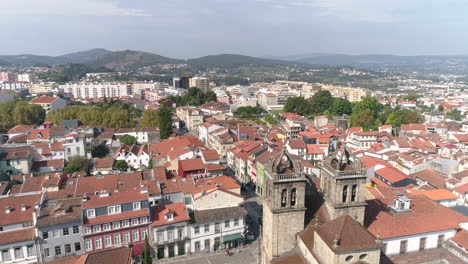 panorama of the city of braga with traditional red tile roof houses from the braga cathedral on a sunny summer day in portugal