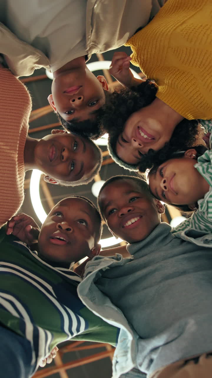Diverse Group of Happy Children Looking Down at the Camera