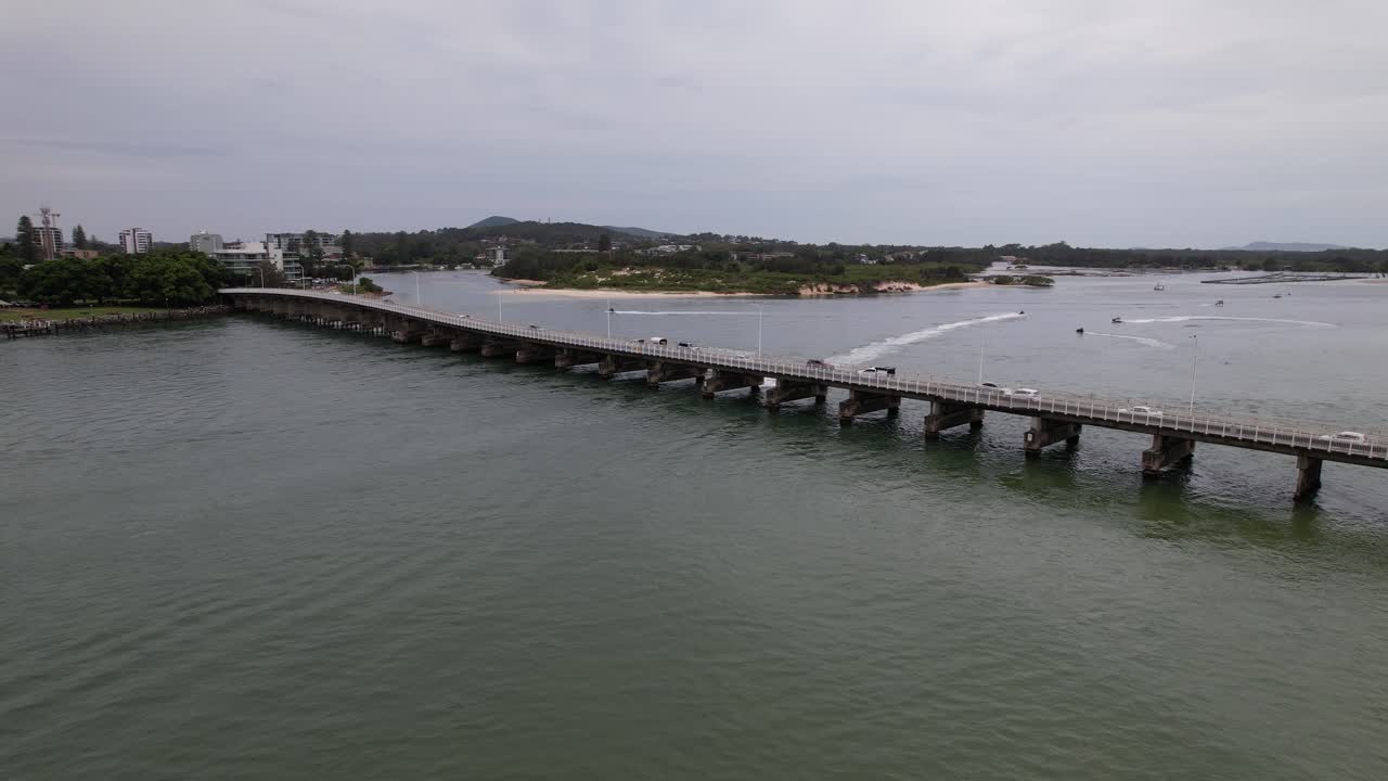 Road Bridge With Traffic Across Coolongolook River In Forster, New South Wales, Australia. drone shot