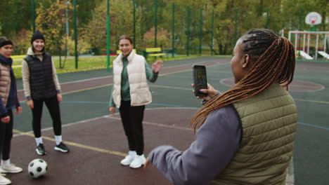 woman recording friends