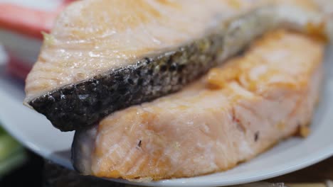 macro shot of attractive juicy salmon fish slices prepared for sushi dish