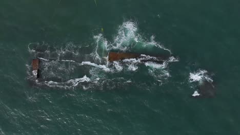 360-degree-vertical-aerial-view-of-dismantling-the-dredger-ship-after-excavating-material-from-the-sea-bed