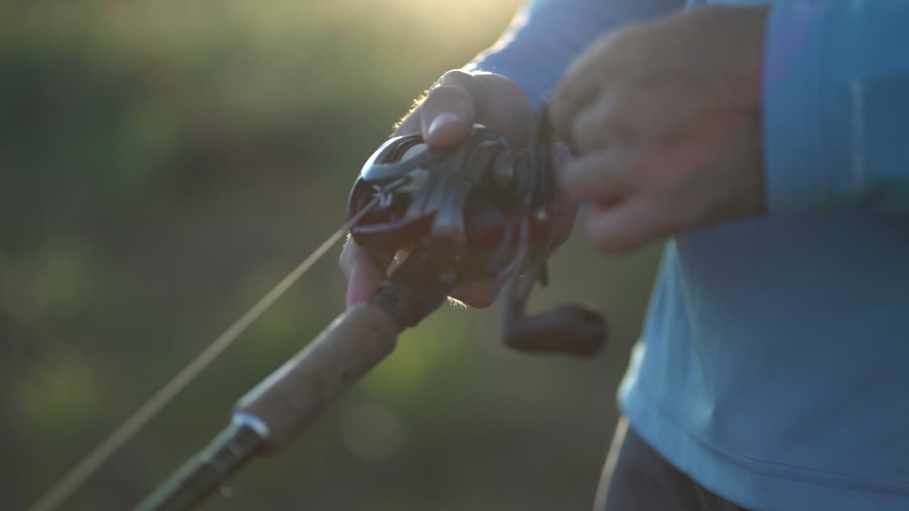 Handle rotation with reel of fishing rod close up