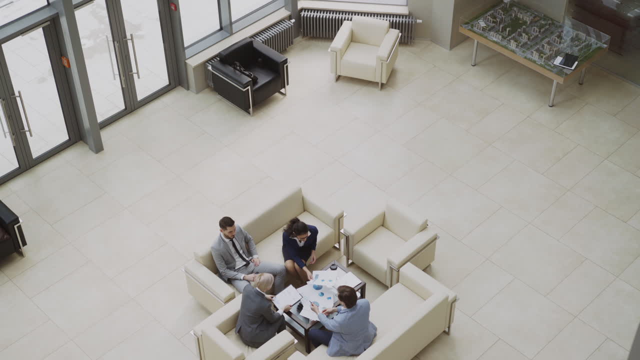 Business Meeting in a Modern Office Lobby