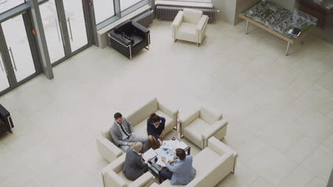 business meeting in a modern office lobby
