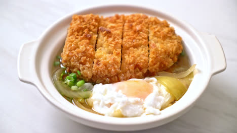 japanese fried pork cutlet with onion soup and egg - asian food style